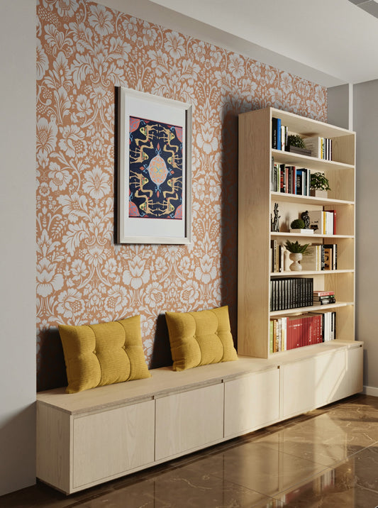 Caravan of Time by Aiman — symmetrical navy and gold ornamental work on paper, shown framed on floral wallpaper.